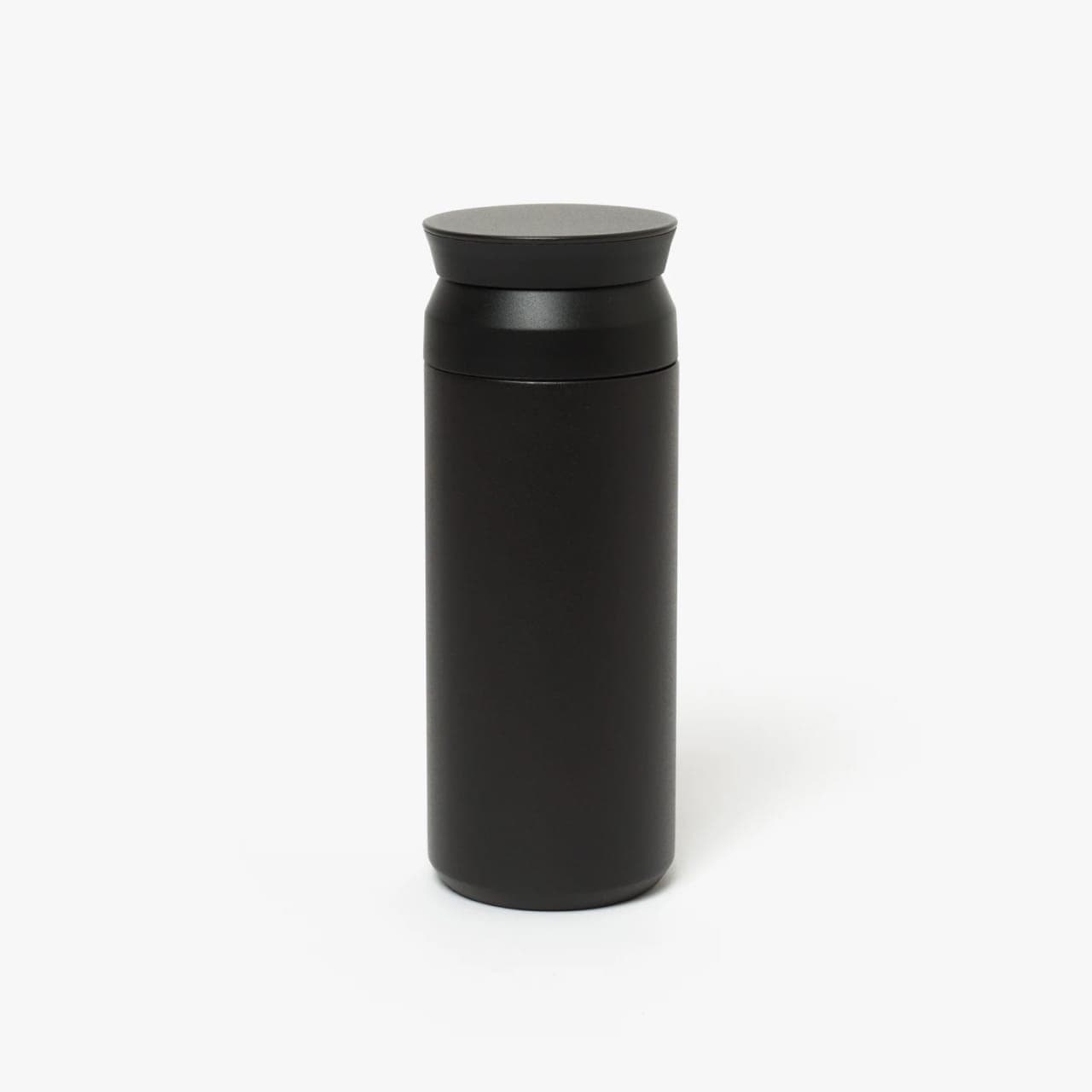 Insulated bottle with white base and black snap lid.